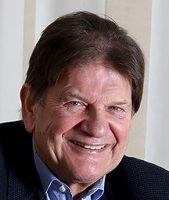 man smiling and looking into camera