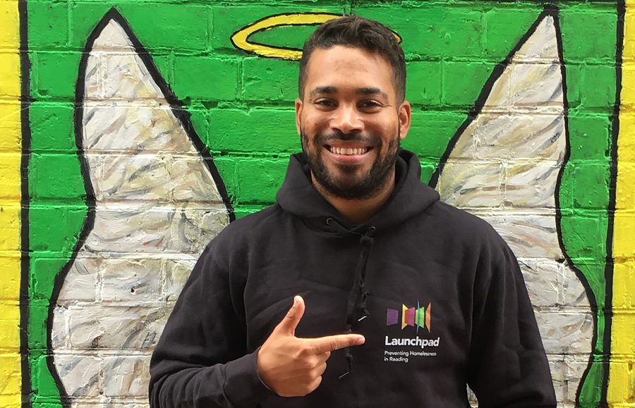 man pointing to the launchpad logo in his hoodie