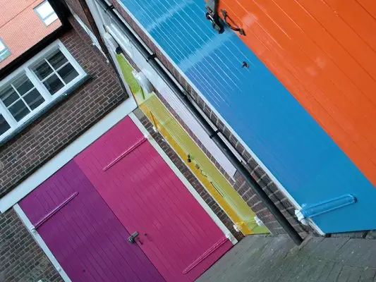 The colourful stable doors at Launchpad's office in Reading town centre, there is a purple, pink, yellow, light green, mid blue and orange door.