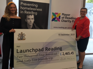 launchpad women holding cheque