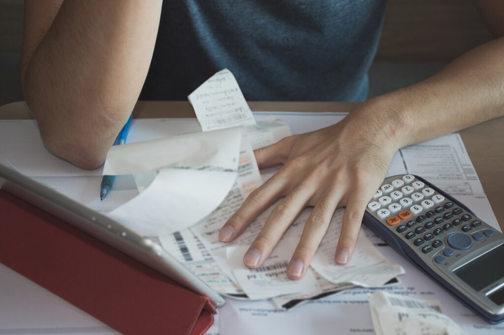 Stock image of someone working out their finances with a calculator