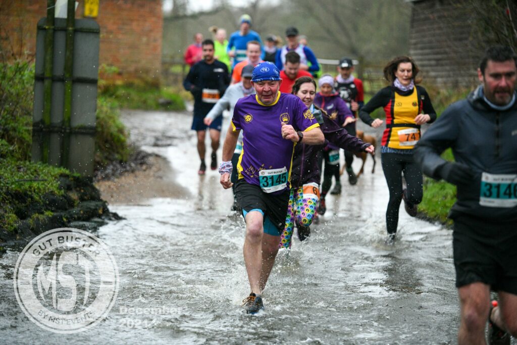 Group of runners taking part in Gut Buster run