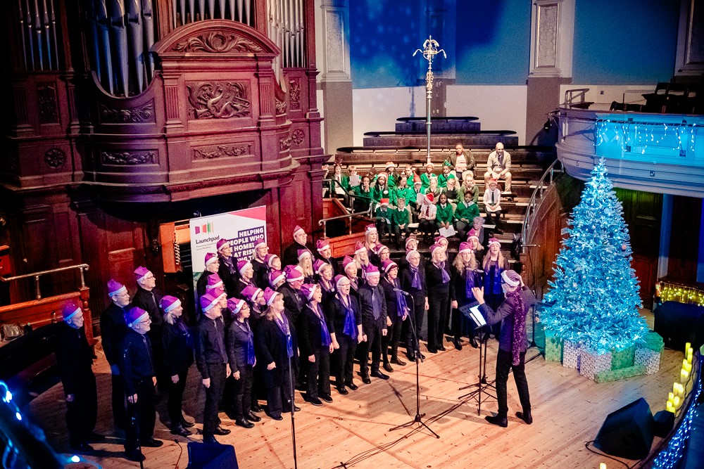 Photograph of Launchpad's 2023 Christmas carols. One of the choirs in action