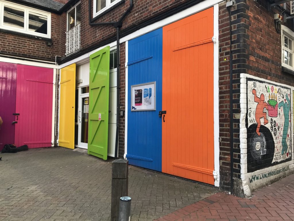 Photo of the colourful Launchpad doors - used to illustrate the 'About us' section of our website