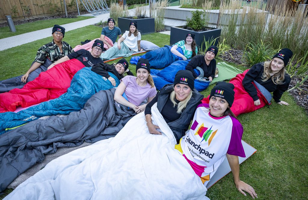 A team of 11 from Frasers UK in their sleeping bags, taking part in their office Big Sleep Out