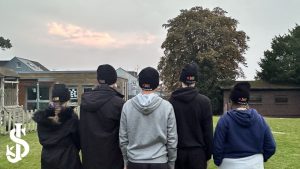 students wearing Launchpad beanie hats 