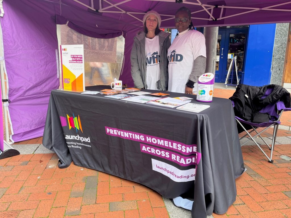 Two staff members at our stand in Reading on World Homeless Day