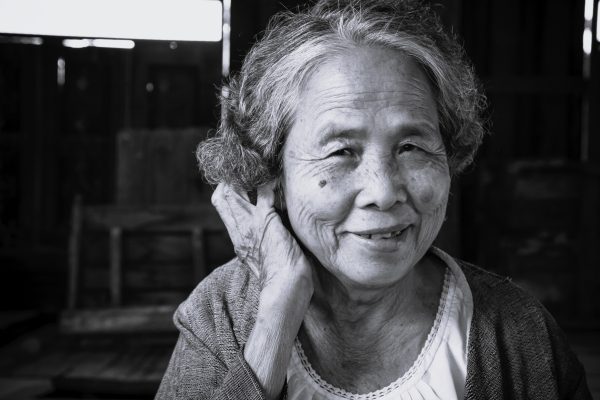 Older Chinese woman looking at the camera