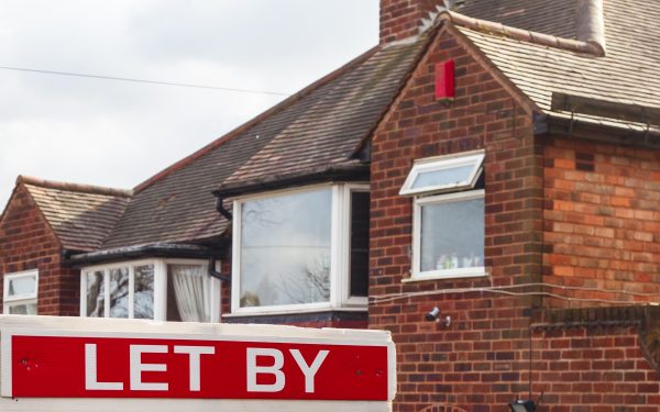 Outside of house with a let by sign