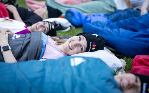 woman in launchpad woolly hat in sleeping bag