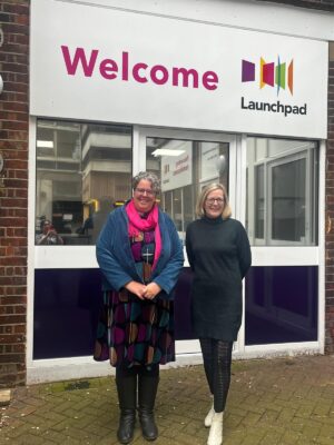 Two women standing outside Launchpad's entrance