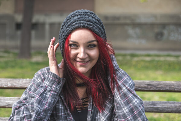 Young girl with red hair looking happy