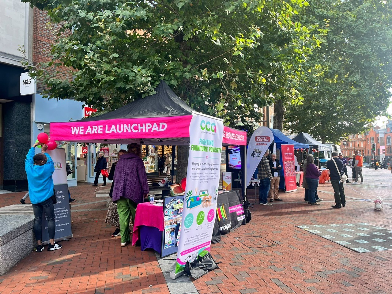 Colourful stand in the street for World Homeless Day