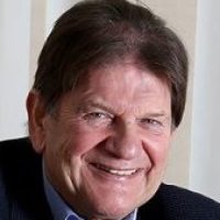 people-sirjohn man smiling and looking into camera